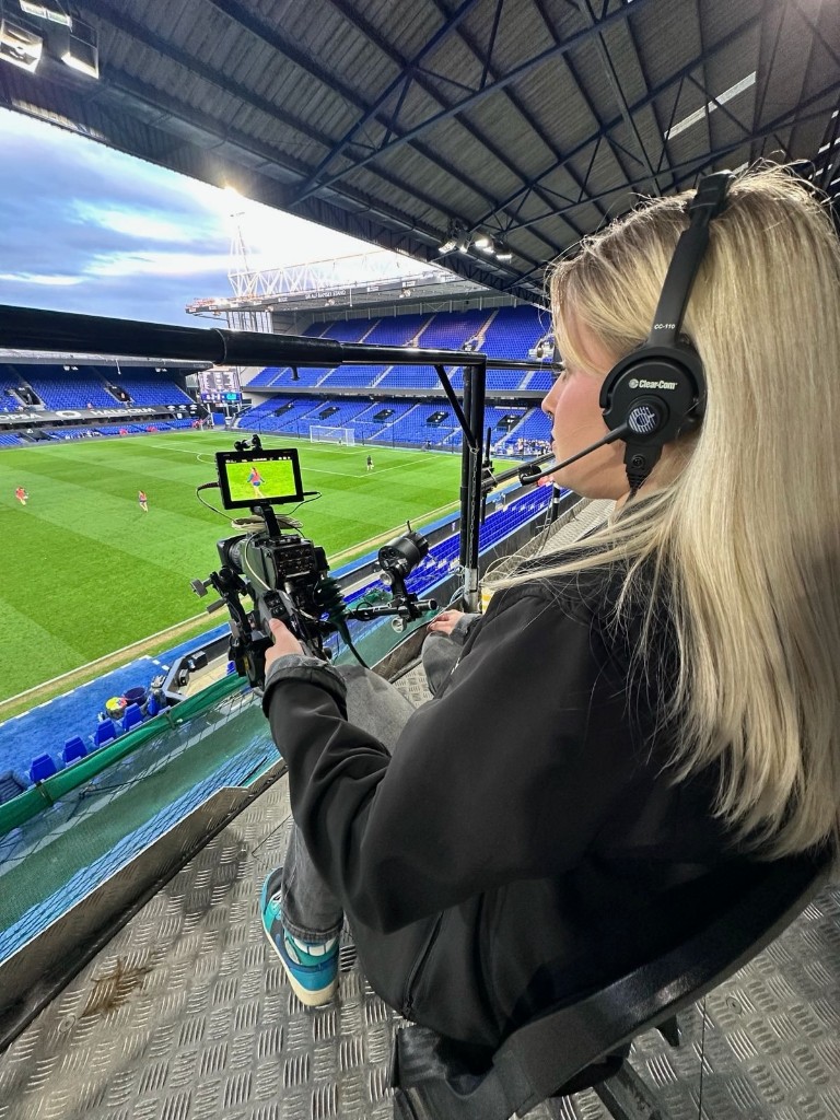 Ellie Lapping camera operating from a stadium gantry